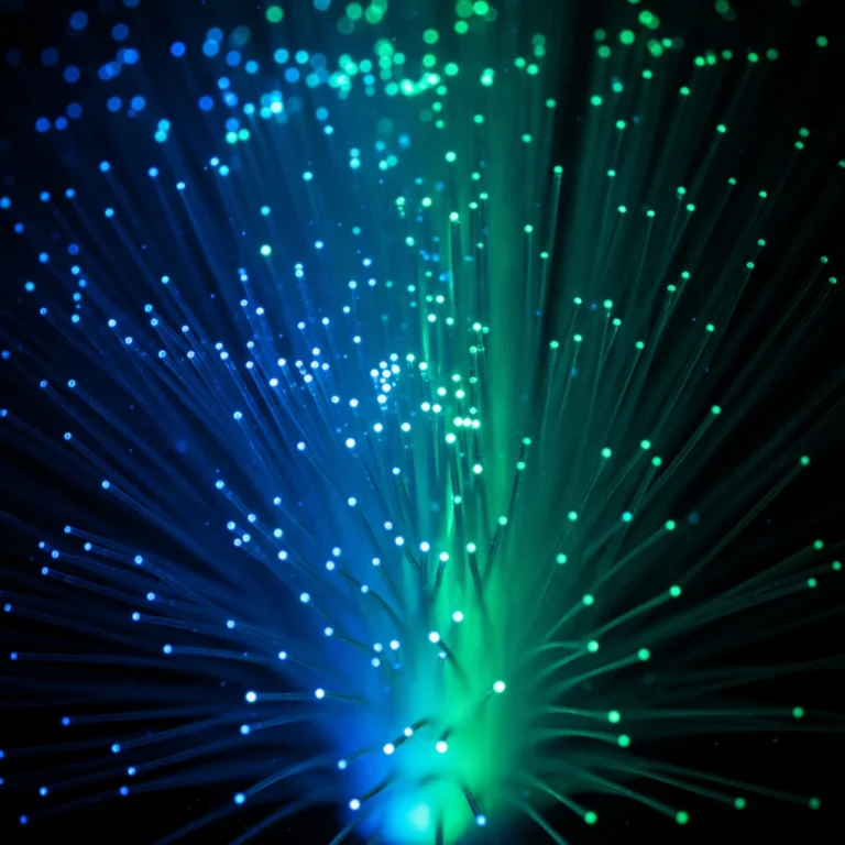 Close up of glowing fiber optic cables representing digital connection and business visibility